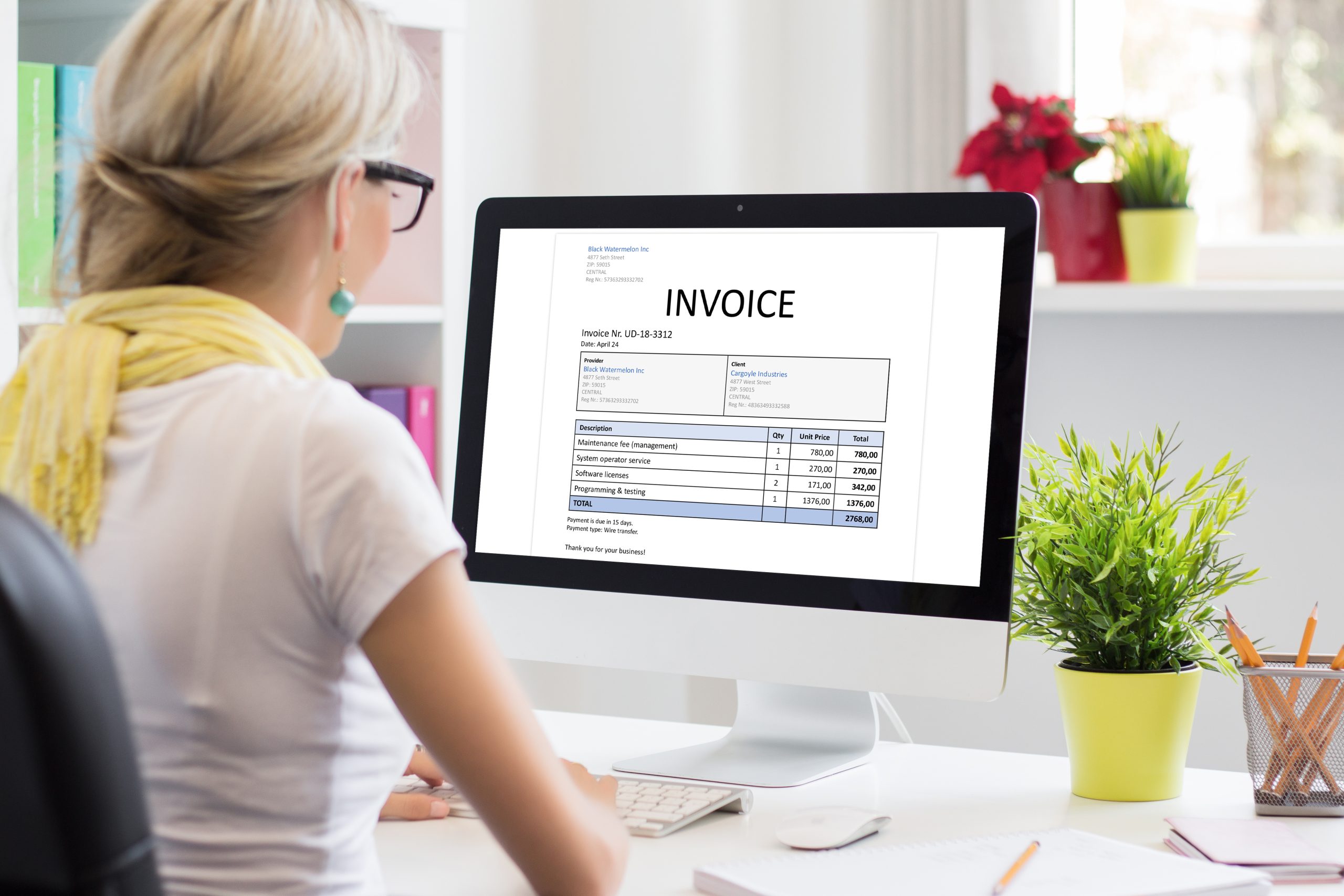 ICON Property Management accounts payable specialist reviewing condominium corporation invoice records using ICON's Advanced Payment Platform.