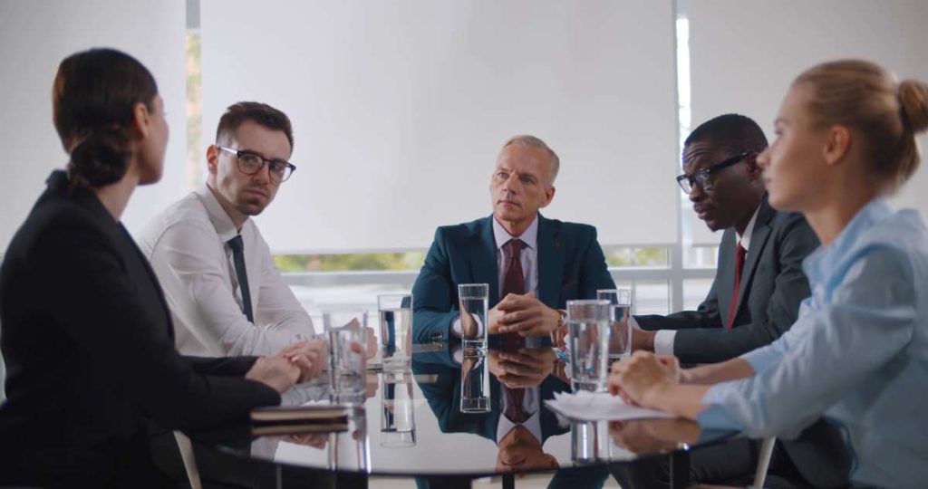 A ground of board members in a Ontario condominium community having a challenging discussion