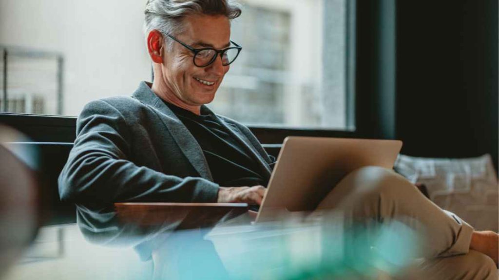 Condo buyer in Ontario reviewing a digital status certificate on a laptop.
