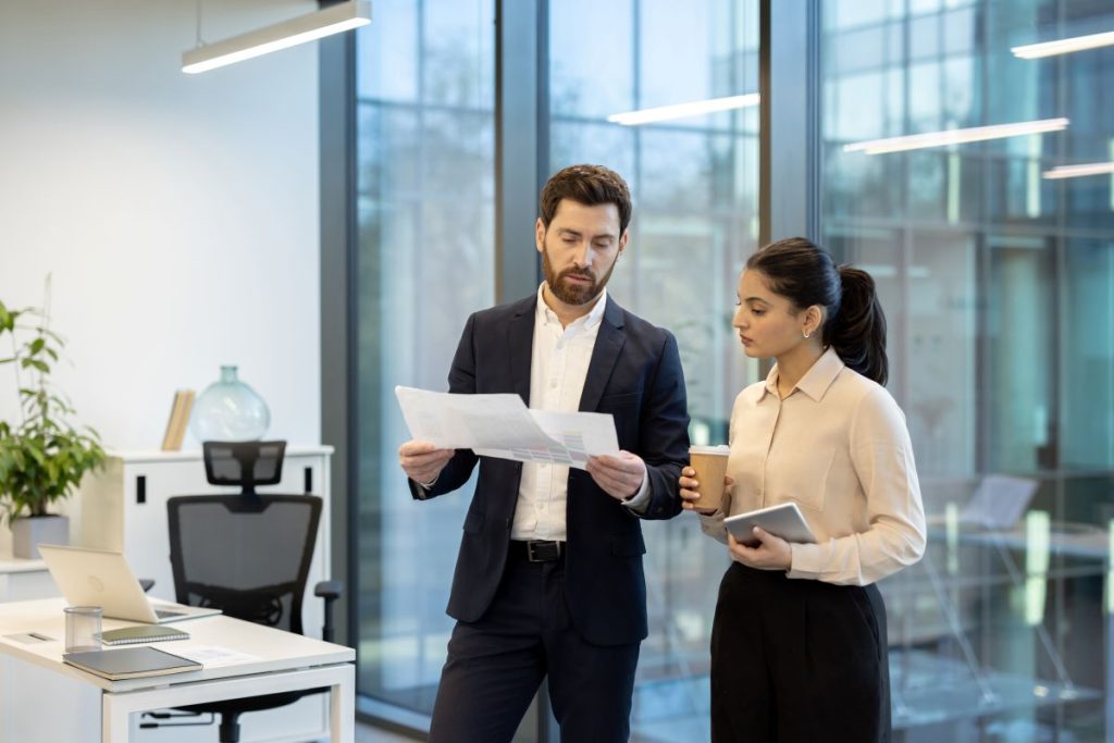 A condominium manager describing to a condo board member key details of the reserve fund study for further reserve fund planning.